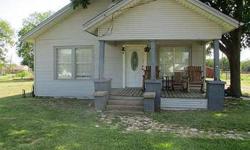 Older home with great features on large corner lot with trees; with carport and storage buildings living room with mock fireplace with gas heater. Karen Richards is showing 308 S Old Walnut Rd S in Ennis, TX which has 3 bedrooms / 2 bathroom and is