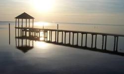 This lot is located in Cooper Landing, an upscale waterfront community of only 18 building lots, directly across the Currituck Sound from the Corolla Lighthouse. The neighborhood is very private. The lot is situated approximately 14.00' above sea level.