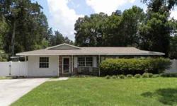 SHORT SALE! Great location for this 4BR/2BA home featuring new roof in 2010, laminate floors thru-out, 1832 sfla, covered front porch, lrg LR w/chandelier, dining area off kitchen w/black applncs, white cabinets, & eat-at bar, family room w/fireplace,