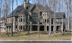 Enjoy Beautiful sunrise views from this elegant custom built castle on the Lake! Strategically placed on over an acre with 400'+ of shoreline. Exquisite detail and quality craftsmanship shows throughout this 5BD, 5 1/2BA, 4 car garage home. Think of an